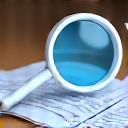 Magnifying glass over a document representing discovery